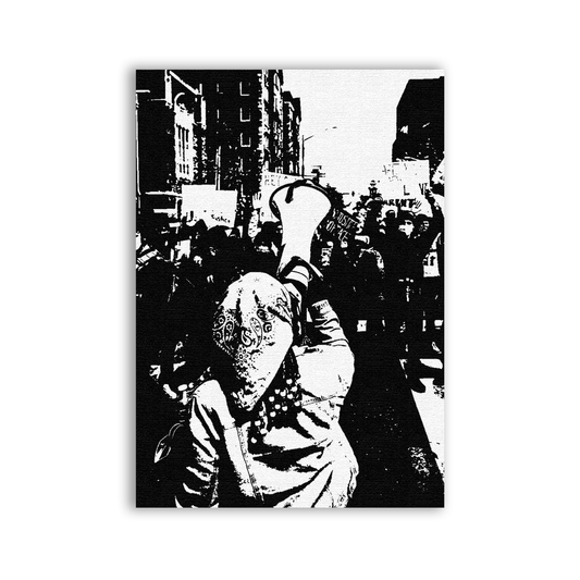 Black and white image of a person holding a megaphone in an urban setting