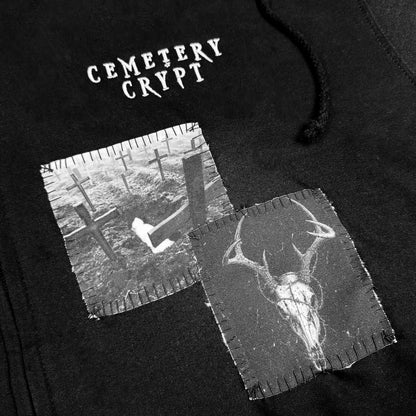 Close-up of patches and embroidered logo on Vulture Patched Zipper Hoodie