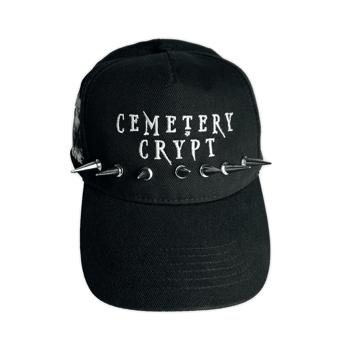 Front of the Burial Patched Cap with white lettering and silver spikes attached across the crown