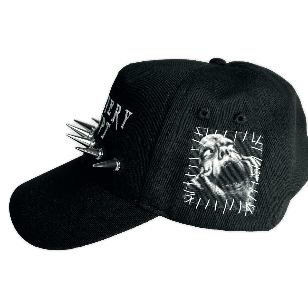 Side of the black Burial Patched Cap with a screaming face graphic patch, white stitching and silver spikes