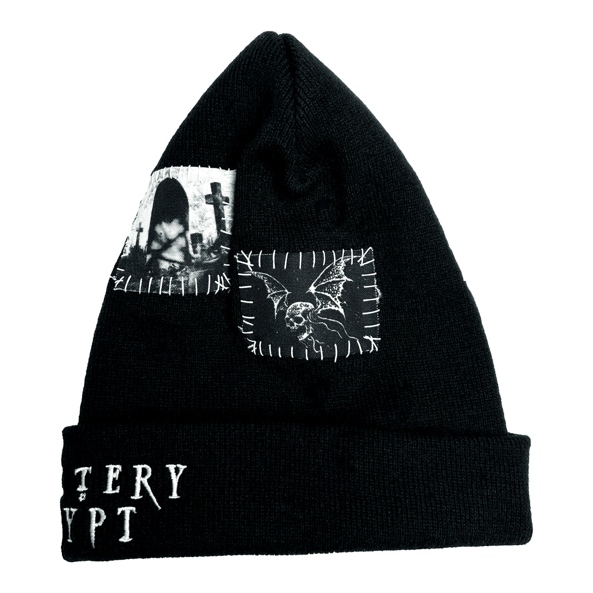 Angled view of the Grave Patched Beanie with monochrome patches and visible white stitching above the cuff