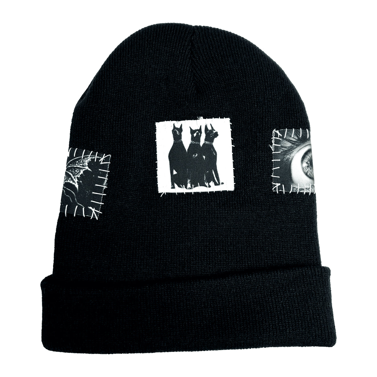 Back of the Grave Patched Beanie showing a hooded figure patch and neighbouring graphic patches