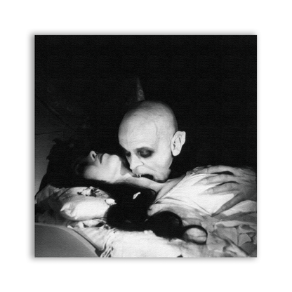 Nosferatu Girl Patch showing a bald vampire leaning over a reclining figure in black and white