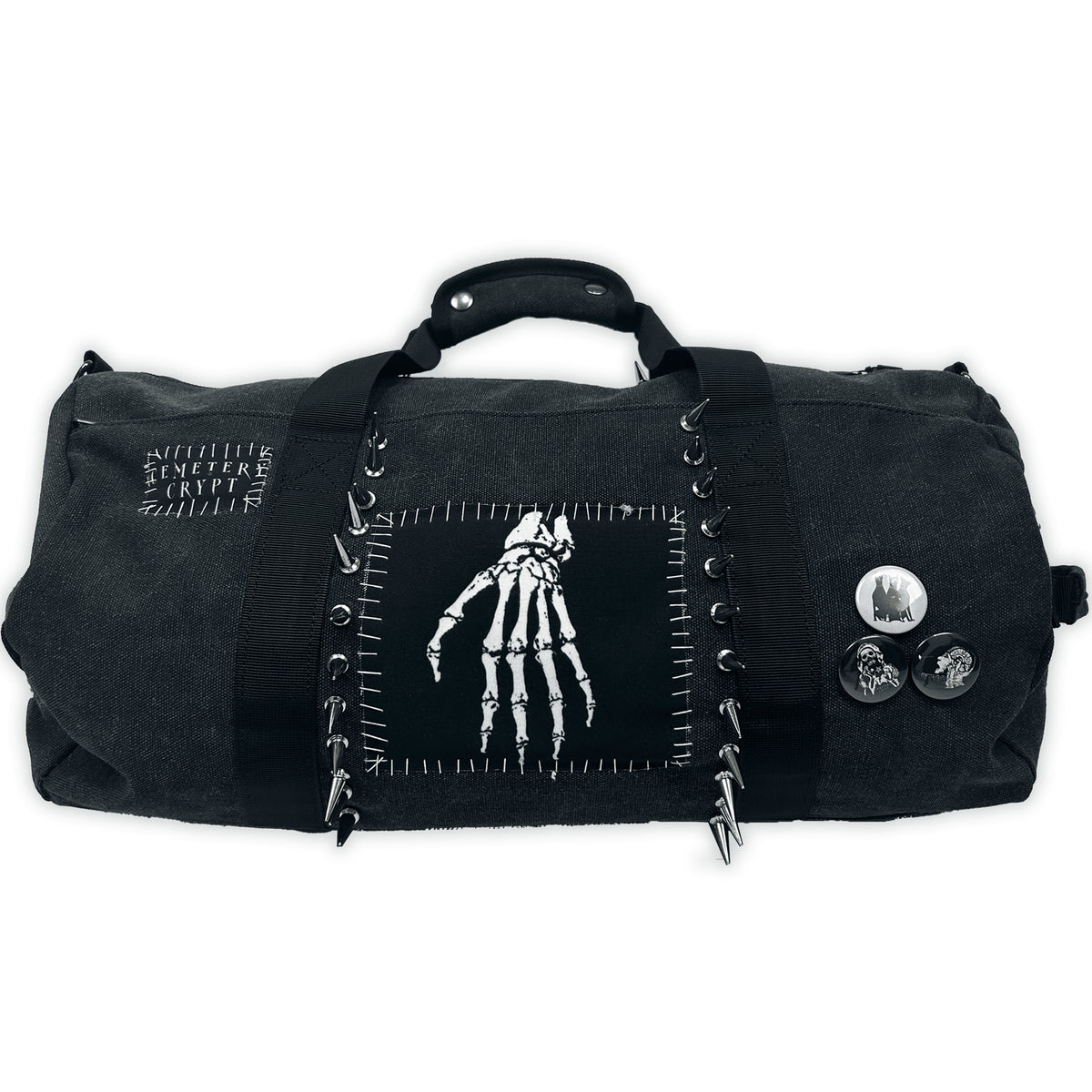 Reverse of the Terror Barrel Bag with a skeletal-hand patch, stitched borders and three round badges
