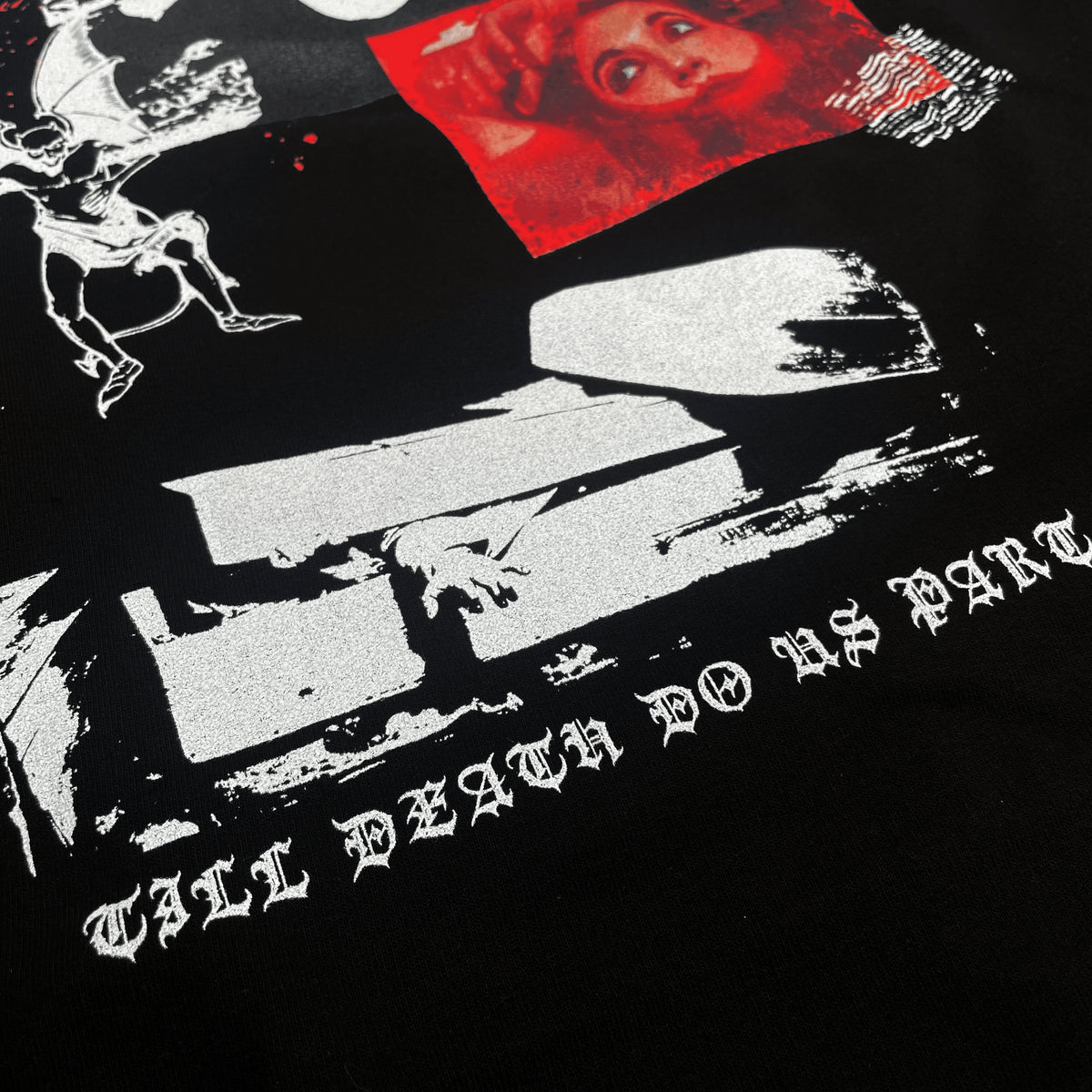 Close detail of the Till Death Do Us Part Hoodie showing the white coffin graphic and gothic lettering