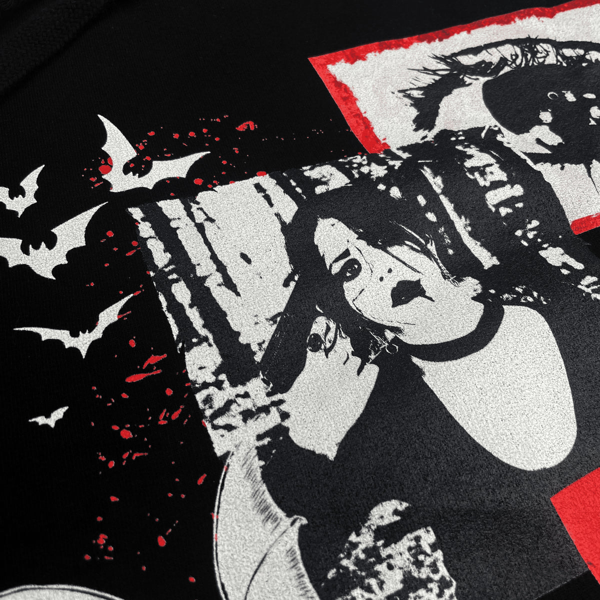 Close detail of the Till Death Do Us Part Hoodie print showing a portrait, eye graphic and bats